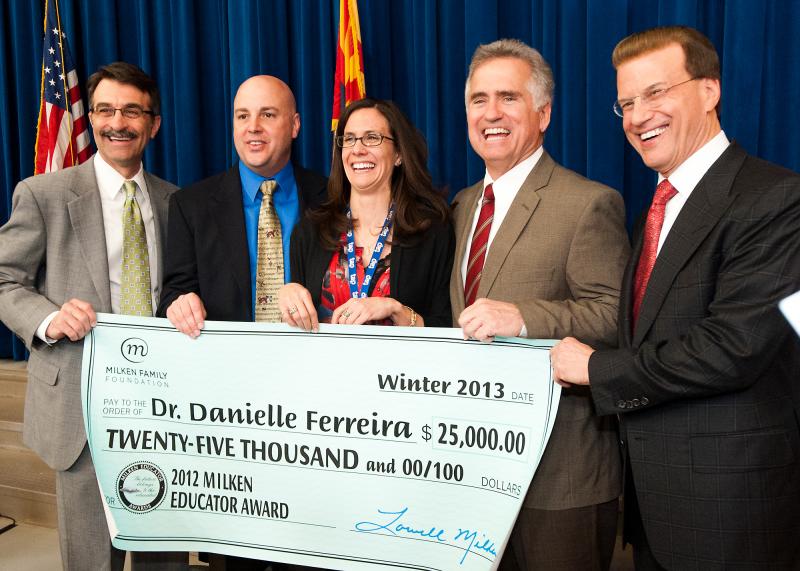 Lowell Milken, Danielle Ferreira and VIPs holding her check Lowell Milken, Danielle Ferreira and VIPs holding her check