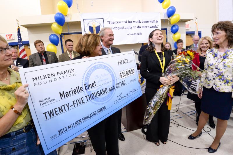 Marielle Emet receives check and cheers Marielle Emet receives check and cheers