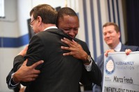 QLA Marco French Lowell Milken hug