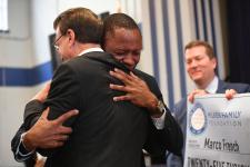 QLA Marco French Lowell Milken hug